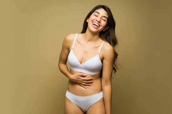 stock image Happy mexican woman in white underwear laughing and having fun with body acceptance and self love 