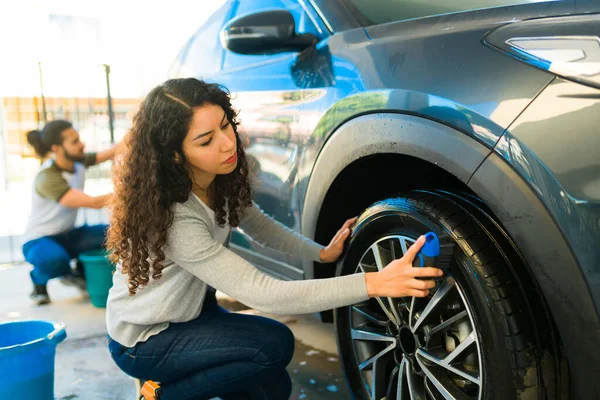 Busy Young Woman Her Outdoor Garage Her Boyfriend Shining Tires — Stock Photo, Image