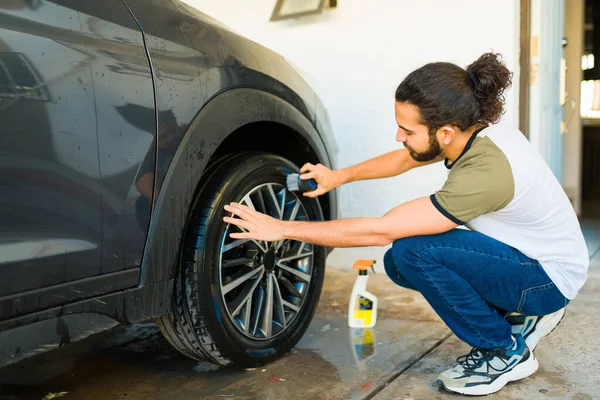 Young Man Shining Tires Brush While Washing Car Home — Stock Photo, Image