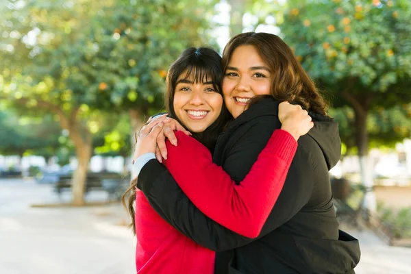 Happy Latin Women Friends Sharing Love Hugging While Smiling Making — Stok fotoğraf