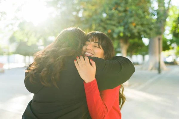 Beautiful Latin Young Woman Hugging Her Best Friend Sharing Love — Stok fotoğraf