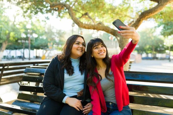 Attractive Women Friends Taking Selfie Smartphone Social Media Bench Park — Stok fotoğraf