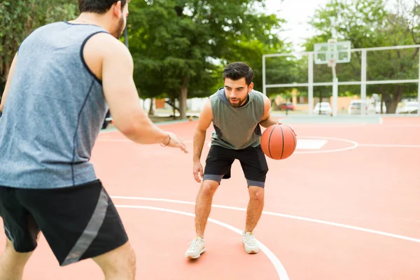 Active Latin Man Playing One One Game Friend Park Basketball — Stok fotoğraf