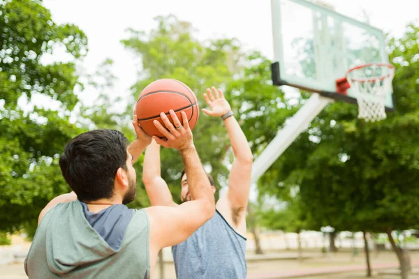 Young Men Throwing Basketball Hoop While Playing One One Game — Stok fotoğraf