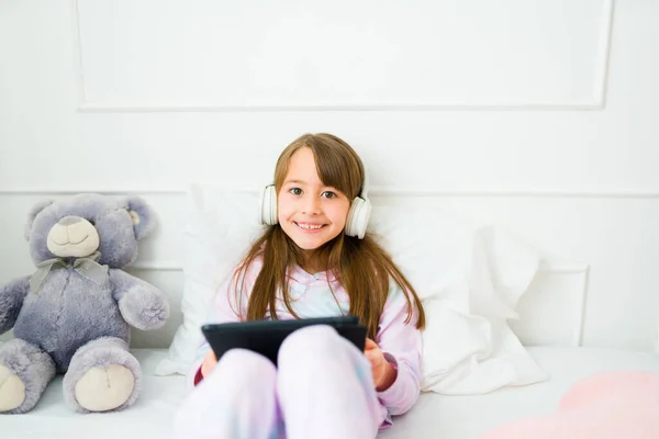 Portrait Cheerful Little Kid Smiling Wearing Headphones Using Tablet Play — Foto de Stock