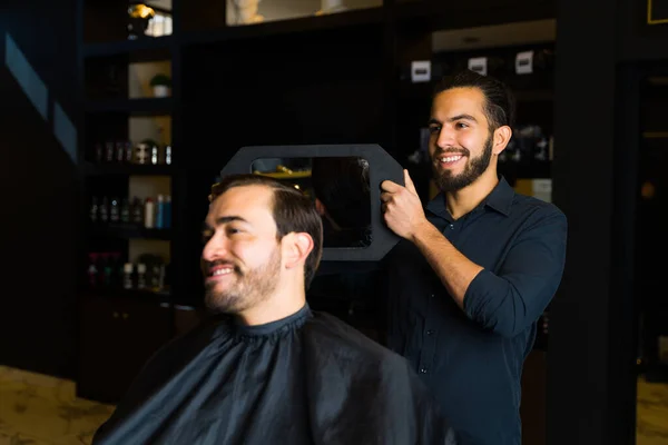 Happy Barber Using Mirror Showing New Haircut Cheerful Man Client — Foto de Stock