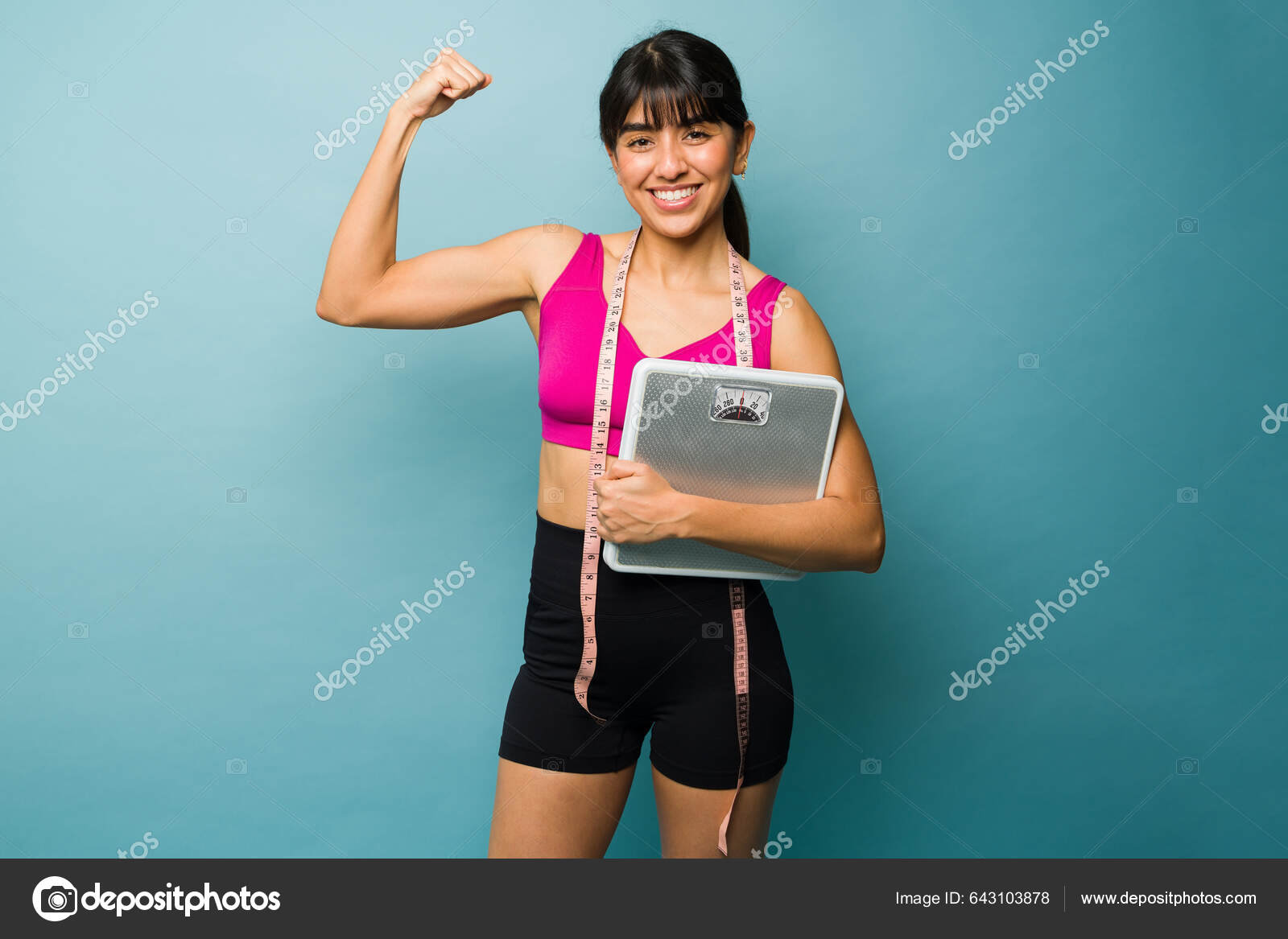 Strong Fit Woman Doing Bicep Curl Showing Her Athletic Body Stock Photo by  ©tonodiaz 643103878