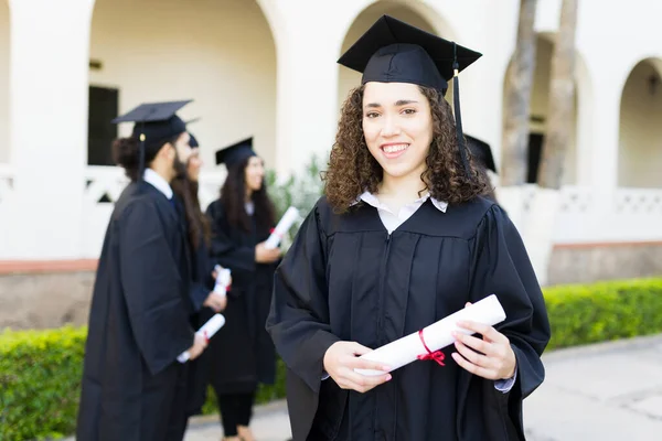 Happy Caucasian Woman Curly Hair Smiling While Wearing Graduation Gown — Fotografia de Stock