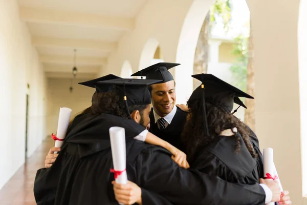 Happy Group Friends Graduates Hugging Circle Celebrating Receiving University Diploma — Fotografia de Stock