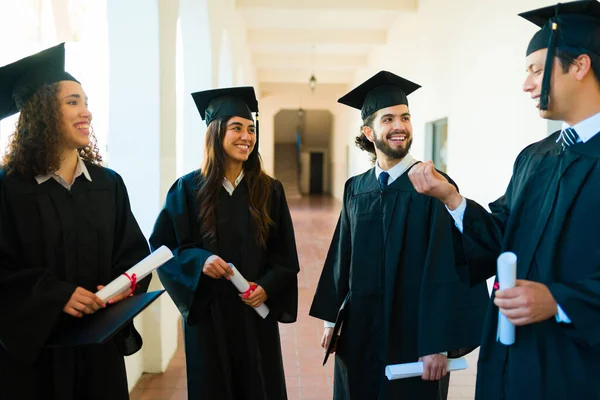 Excited Group Friends Chatting Graduating University While Laughing Wearing Graduation — Fotografia de Stock