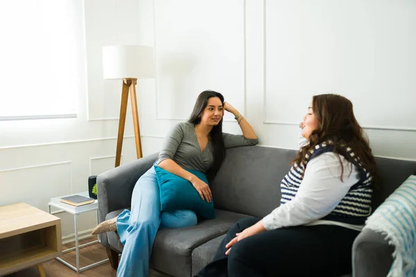 Latin Young Female Friends Relaxing Sofa Chatting Lives Gossip While — Foto Stock