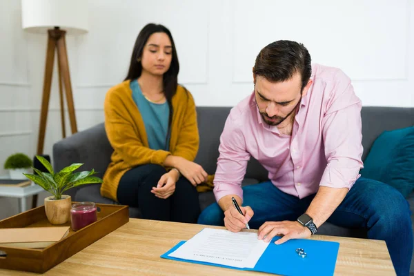 Caucasian Angry Man Signing Divorce Papers Sad Hispanic Woman Sitting — Stock Photo, Image