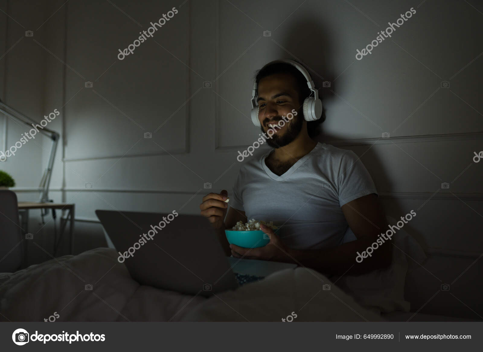 Happy Man Laughing While Watching Movie Eating Popcorn Headphones