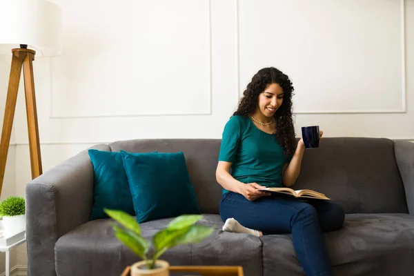 Relaxed Young Woman Relaxing Couch Drinking Coffee While Reading Book — Stock Photo, Image