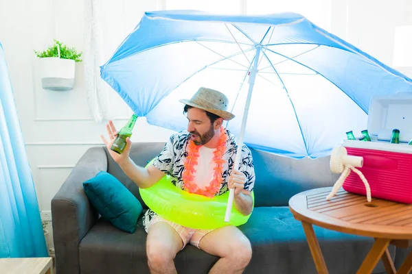 Funny Mid Adult Man Dancing Using Inflatable Parasol While Drinking — Stock Photo, Image