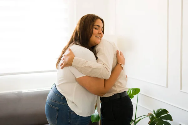 Happy Latin Woman Smiling Looking Cheerful While Hugging Her Psychologist — Stock Photo, Image