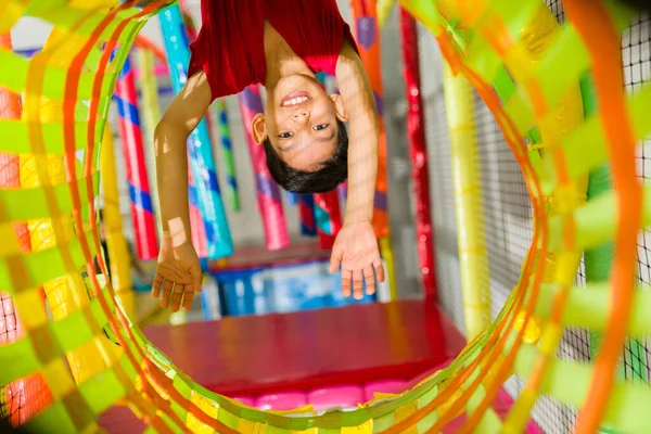 Funny Young Kid Hanging Upside While Playing Game Having Fun — Stock Photo, Image