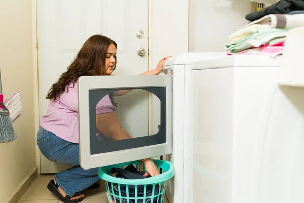 Side View Hispanic Woman Putting Dirty Laundry Washing Machine While — Stock Photo, Image