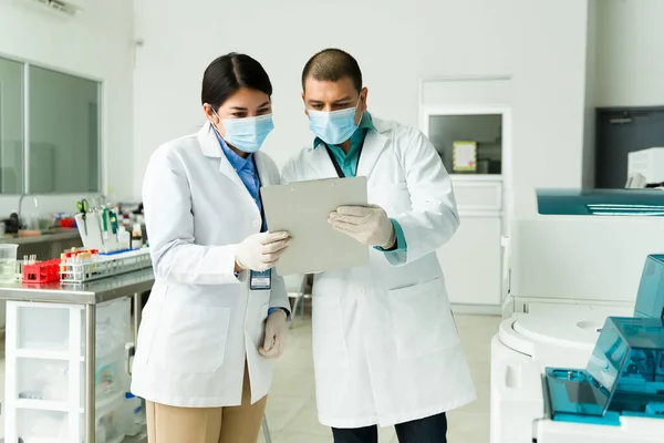 Caucasian Woman Latin Man Face Masks Working Chemists Checking Medical — Stock Photo, Image