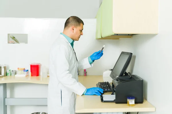 Mexican Man Chemist Typing Computer Holding Blood Sample Test Tube — Stock Photo, Image