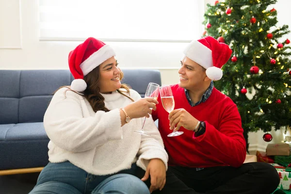 Latin Cheerful Couple Santa Hats Drinking Champagne Making Toast Saying — Stock Photo, Image