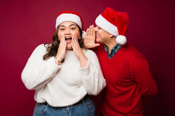 Hispanic Man Whispering Secret Size Woman Looking Surprised Christmas Holidays — Stock Photo, Image