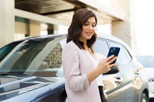 Professional Woman Blazer Checks Her Smartphone Driving Standing Her Car ภาพสต็อก