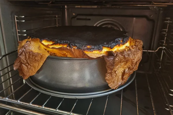 A burnt cake or a pie in the oven. Homemade food