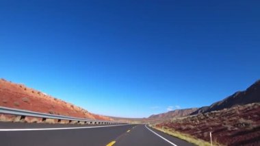 A car drives along a beautiful scenic road in California, USA