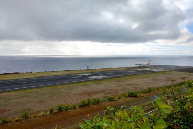Madeira, Portugal, November 25, 2022: Airplane landing on the runway at Madeira airport