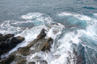 Aerial view of sea waves and fantastic rocky shore