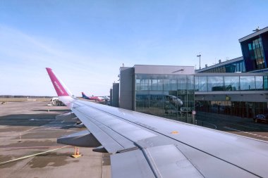 Katowice, Poland, November 22, 2022: view of the airport and other aircraft at the airport from the window of the aircraft