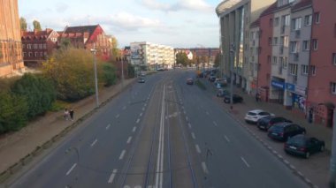 Szczecin, Poland, October 1, 2022: view from a height of the city traffic. The movement of modern trams. The tram is an ecological mode of transport