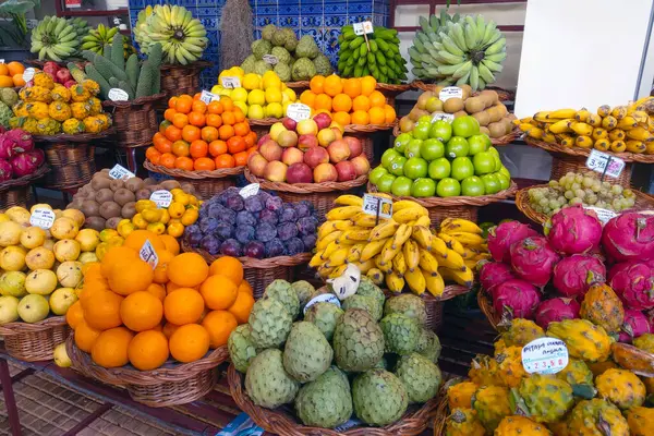 Madeira, Portugal, 27 November 2022: Delicious fresh fruits on the counter. Tropical fruits