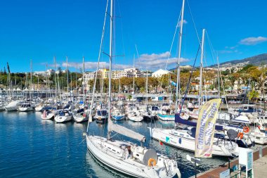 Madeira, Portugal, 24 November 2022: beautiful boats on the pier in Funchal. Boats and yachts are moored