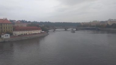View of a cloudy autumn day in Prague and the river