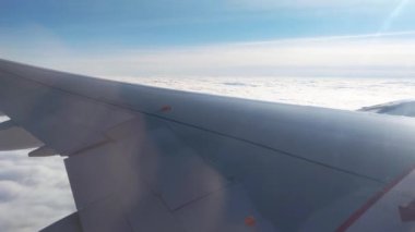 View of the sky from the window of a flying plane