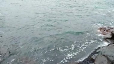 Beautiful turquoise water washes the coast of the island or mainland