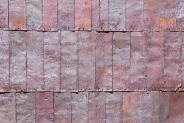 Eski bir çitin ya da çatının paslı dokusu, metalin dokusu.