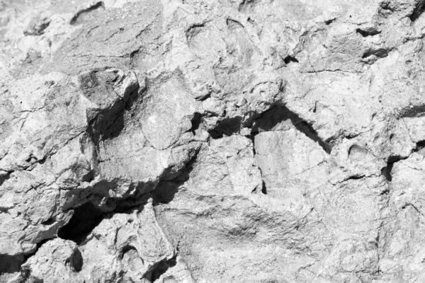 Black and white photo of rock texture in the mountains