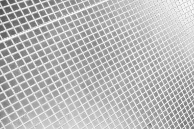 Tek renkli fotoğraf, doğrusal düzende küçük kare karolardan oluşan soyut bir deseni gösteriyor. Geometrik tasarım ve minimalist stil modern iç tasarım, grafik tasarım veya web tasarımı projeleri için ideal bir zemin veya doku oluşturur..