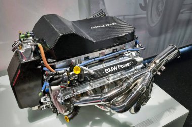 Munich, Germany, August 25, 2024: High-performance bmw racing engine showcasing advanced automotive engineering and design. highlighting precision mechanics, this powerful engine model represents cutting-edge technology in motorsport performance and  clipart