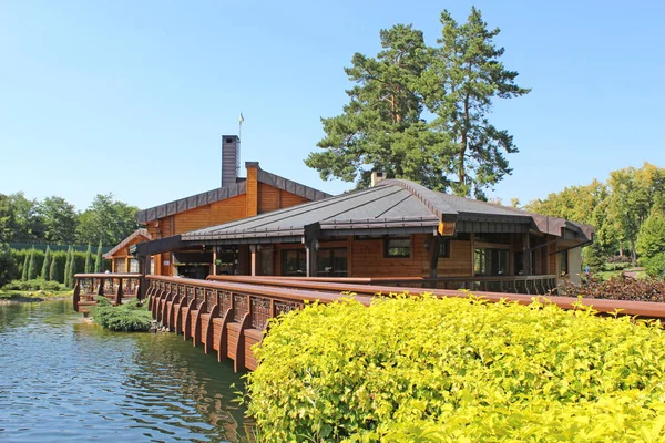 stock image wooden house on the river. house near the river in the forest