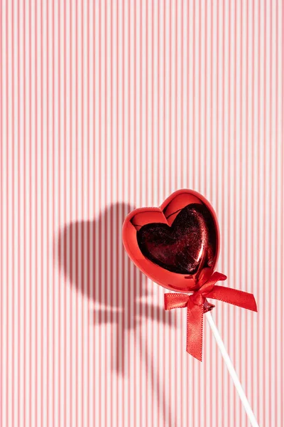 Heart Shaped Balloon Bow Tie Stick Strong Shadow Striped Red Stockbild