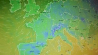 Temperature and wind map Europe shot of a computer screen. Moving camera shot of a computer screen. Weather satellite view map. Precipitations, temperatures, air pressure. Meteorology live view countries continents.