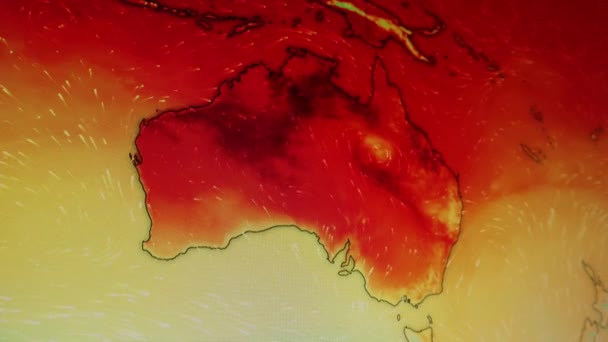 澳大利亚上空的热浪炎炎夏日 电脑屏幕上的一个镜头监控着Pixels看得见的移动相机对电脑屏幕的拍摄 气象风向卫星视图图 气象观测大陆 — 图库视频影像