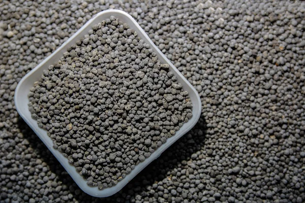 Composite mineral fertilizers.Mineral fertilizers granules. Could be a natural chemical extract or prod.Mineral fertilizer packed in small containers.
