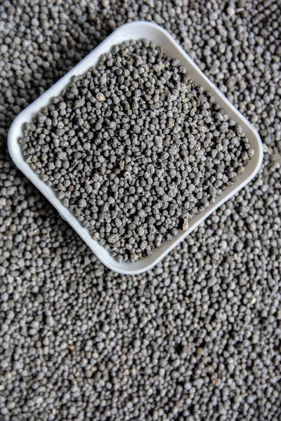 Composite mineral fertilizers.Mineral fertilizers granules. Could be a natural chemical extract or prod.Mineral fertilizer packed in small containers.