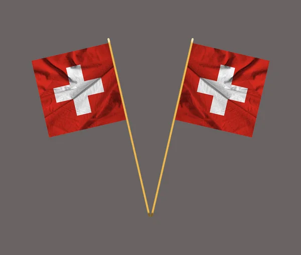 Classic view of the national flag of Switzerland .Flag of Switzerland blowing in the wind.