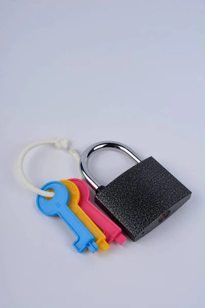 Lock and Keys .Closeup of padlock with keys.Metallic padlock with three keys in keyhole .